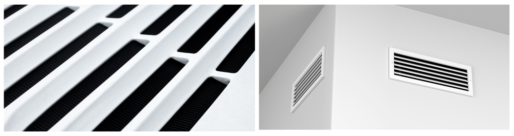 White, clean air vents for heating or cooling installed on a wall, emphasizing the importance of professional dryer vent cleaning to maintain efficiency, safety, and indoor air quality.